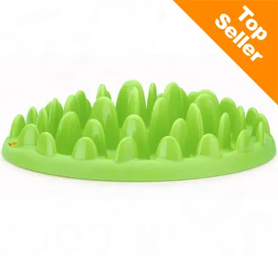 Vihreä muovinen lemmikin ruokakuppi, jossa on useita kohoumia. Oikeassa yläkulmassa oranssi merkintä: Top Seller.