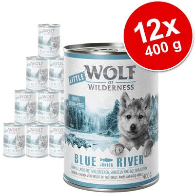 Wolf of Wilderness Little Blue River, 12 x 400 g conserve. Text vizibil: 100% grain-free, Blue River Junior, Huhn & Lachs mit Waldbeeren, Wurzeln und Wildkräutern. Ambalaj metalic.