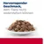 Hervorragender Geschmack, dem Tiere nicht widerstehen können (texte en allemand) au-dessus d'une assiette de bouchées en sauce pour animaux.