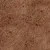 Close-up of a brown, grainy texture with red and dark accents. Material or surface not further specified.