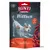 Sachet Rinti Extra Bitties 100g, morceaux tendres de poulet, mention 'ohne zucker', 'mit tomate & kürbis', texte allemand 'weiche huhnstückchen' visible sur l'emballage.