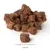 Brown, cube-shaped snacks measuring 1.5 cm. Close-up of texture and dimensions.