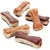 Varios snacks en forma de hueso para perros, con capas visibles de diferentes colores marrón y beige. No se muestra marca ni texto en el producto.
