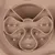 Close-up of a beige anti-gulping bowl with multiple indentations and elevations for slow food intake.
