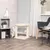 Cat tree with two sisal posts, plush lying surface and play ball. White room with decorations such as plant, camera and furniture.