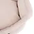 Close-up van een beige, gevoerd stoffen bed met zachte randen.