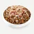 Bowl with brown dry food pieces, topped with shredded chicken and duck meat.