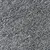 Primo piano di una texture bianca e nera, possibilmente tessuto o materiale per tappeti.