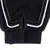 Close-up of a black glove with hook-and-loop fastener and breathable mesh material.