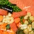 Image showing key ingredients: salmon, seaweed, sweet potato, garden vegetables and peas, each labelled to highlight the product’s main components.