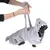 Dog in grey shark costume with hood. Person demonstrates carrying function of the costume by holding the integrated straps.