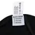 Pflegeetikett mit Materialangaben: Außenmaterial 100% Nylon, Innenmaterial 100% Polyester. Eigenschaften: wasserdicht, winddicht, atmungsaktiv. Waschhinweise und Herkunft: Made in China.
