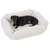 Dog lying in a white, fluffy pet bed. Product shows the comfort and design of the bed.