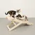 Two cats on a wooden scratching ramp with the inscription 'natural paradise'.