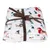 Manta branca com motivos de cães e árvores de Natal, atada com fita de presente castanha.