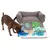 Brown dog examines a grey snuffle mat with colourful fabric elements in blue, green and beige.