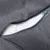 Close-up of a grey cover with zip showing a white padded inner filling.