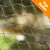 Närbild av grönt nät i plast med orange hörnmarkering med texten 'Top Seller' uppe till höger. Närbild av grönt nät i plast med orange hörnmarkering med texten 'Top Seller' uppe till höger.