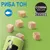 COSMA PURE LOVE SNACKIES, риба тон. Кубчета лакомства върху зелен фон, разсипани от опаковка с черна котка.