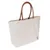 Bolsa de tela beige con asas marrones y pequeña etiqueta negra con el logo en la parte inferior derecha.