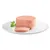 Fetta di paté di carne rosa su piatto bianco, decorata con foglia di prezzemolo fresco.