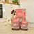Three bags of Lily's Kitchen Proper Food for Dogs Puppy Recipe with chicken, salmon and peas, labelled 'Proper Meat', shown next to a dog in a kitchen setting.