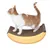 Chat roux et blanc debout sur un griffoir en carton en forme de banane, surface texturée visible.