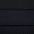 Czarny materiał z małymi, regularnymi szarymi kropkami. Odpowiedni na tapicerkę lub dekorację.