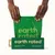 Earth Rated unscented dog waste bags, 300 pieces, green packaging with bag dispenser. Hands pull a bag from the box.