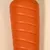 Orangefarvet, rillet legetøj af gummi. Ingen yderligere oplysninger synlige.