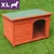 Cuccia in legno per cani, tetto piatto verde, misura XL indicata da riquadro viola con scritta 'XL' e sagoma di cane bianca in alto a sinistra.