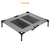 Raised grey bed with mesh surface, length 92 cm. Four black legs and carrying handles visible.