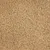 Close-up van kattenbakvulling met beige korrels en kleine groene stukjes, materiaal niet gespecificeerd.