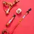 Set of dog harness, lead and ball with colourful pattern. Text on harness and lead: 'High Hopes'.