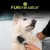 FURminator. Hund wird mit einer grauen Bürste gepflegt, Fokus auf Fellpflege.