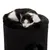 Chat noir et blanc allongé sur le dessus d’un arbre à chat cylindrique en tissu noir, ouverture ronde visible sur la partie inférieure. Chat noir et blanc allongé sur le dessus d’un arbre à chat cylindrique en tissu noir, ouverture ronde visible sur la partie inférieure.