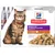 Hill's Science Plan Sensitive Stomach & Skin Adult 1–6 with Turkey, morceaux en sauce, emballage avec photo de chat et croquettes visibles. Texte en anglais sur l'emballage.