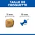 Comparaison de la taille des croquettes : une croquette de 11 mm de diamètre à côté d'une punaise de 10 mm de diamètre.