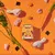 Naturediet Feel Good Turkey & Chicken food pack surrounded by raw chicken, carrots, rice grains and vegetable pieces, highlighting main ingredients.