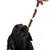 Black dog chewing on a long, twisted chew snack held by a hand.