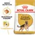 Royal Canin Adult German Shepherd hundefoderpose med billede af schæferhund, tekst: Breed Nutrition, Skræddersyet foderpille, Fordøjelsesevne, samt formet foderpille vist.