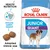 Royal Canin Junior Giant -koiranruokapakkaus, kuvassa myös kaksi nappulaa, tekstit: Health Nutrition, Immune system support, Adapted kibble size. Kuvassa bernhardinkoira. Royal Canin Junior Giant -koiranruokapakkaus, kuvassa myös kaksi nappulaa, tekstit: Health Nutrition, Immune system support, Adapted kibble size. Kuvassa bernhardinkoira.