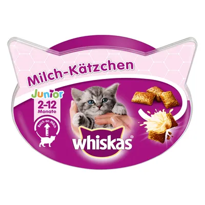 Envase de Whiskas Milch-Kätzchen Junior 2–12 Monate, muestra un gatito, trozos rellenos y crema. Texto en alemán: reich an Milch. Marca Whiskas visible en el centro.