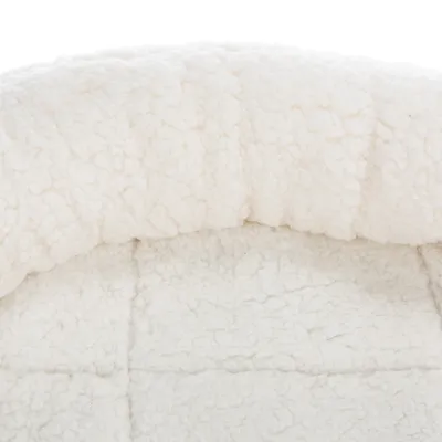 Close-up of a white, soft plush material with a textured surface, suitable for upholstery or bed covers.