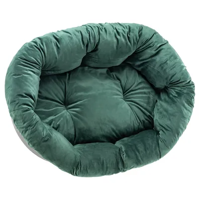 Rond, gevoerd bed in donkergroene kleur met zacht oppervlak en doorgestikt design.