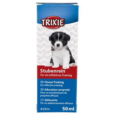 Envase de Trixie Stubenrein, 50 ml. Texto visible: House Training, Educateur propreté, Abituante. Para un entrenamiento de limpieza eficaz. Imagen de cachorro en el frontal.