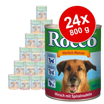 Pack de 24 latas de 800 g de comida para cão Rocco Herbst-Menue, texto visível: Hirsch mit Spiralnudeln. Destaques: metabolismo ativo, digestão saudável, pelo brilhante.