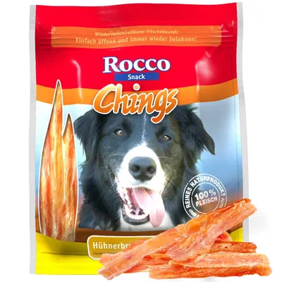 Rocco Snack Chings, sachet de friandises pour chien avec morceaux de poitrine de poulet séchée, texte visible : 100 % Fleisch, reines Naturprodukt, Hühnerbrust.