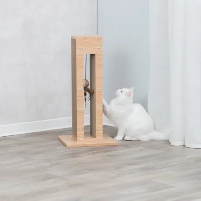 Scratching toy made of wood with integrated toy, shown with a white cat playing.