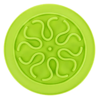 Green round silicone mat with wavy patterns to slow down food intake.